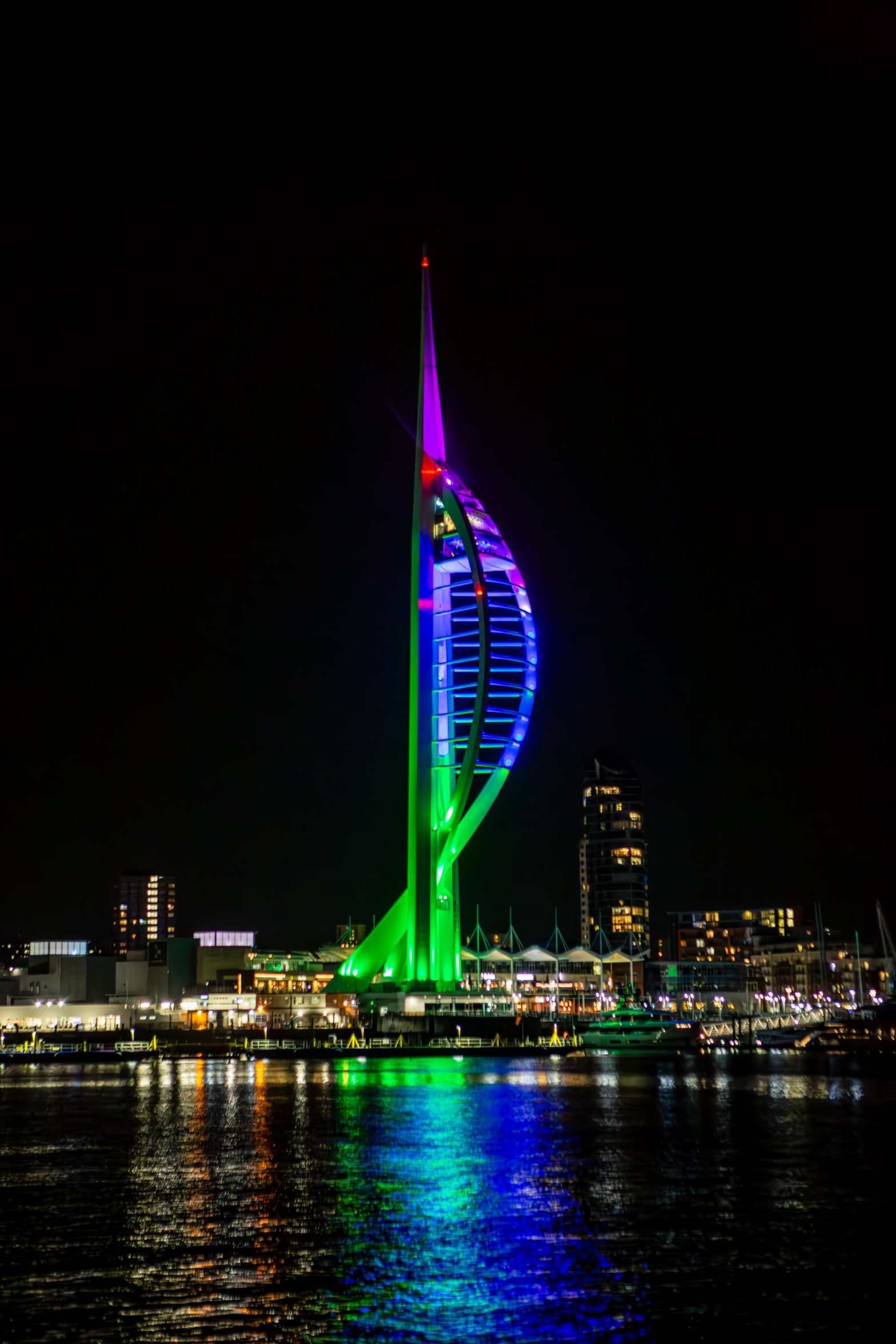 A photo of the Spinnaker tower lit up in colours for Rare Disease Day 2024